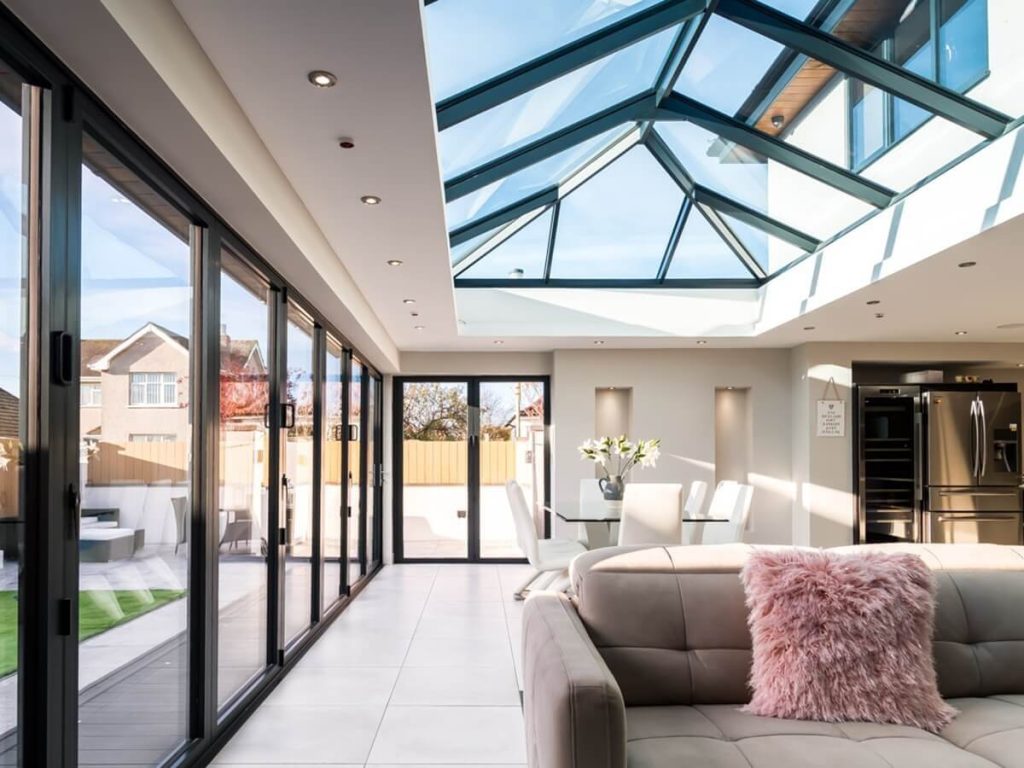 This image shows an Atlas Roof Lantern installed in a modern kitchen and dining extension, providing abundant natural light. The design complements the open-plan space, illustrating the versatility of the product for bright, functional interiors.